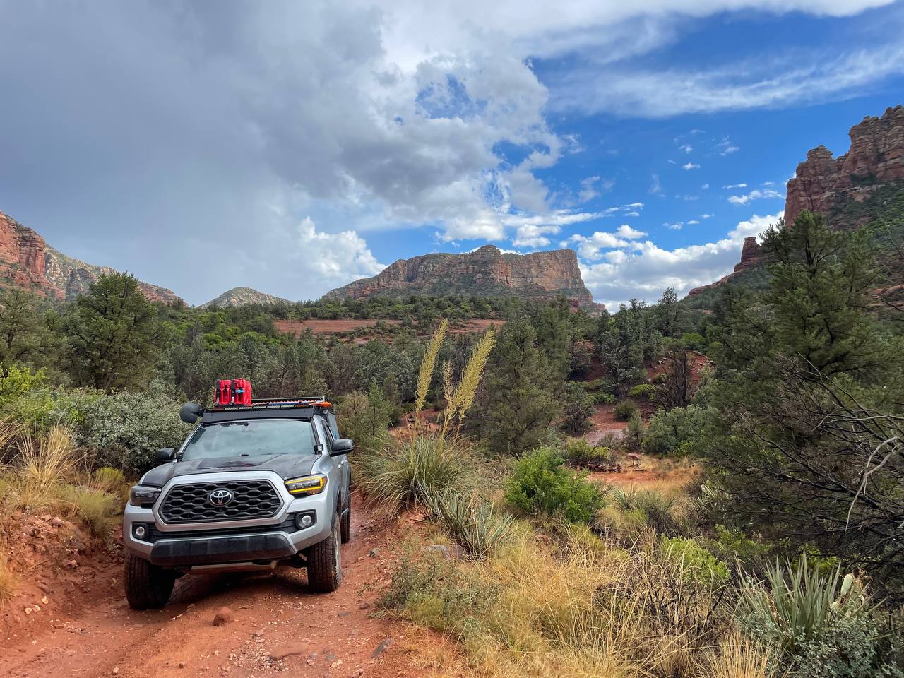 Survived Broken Arrow Trail in Sedona, gorgeous red soil and green plants